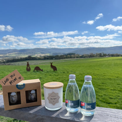 Two bottles of soda and tonic water with a scenic background of kangaroos and a grassy field.